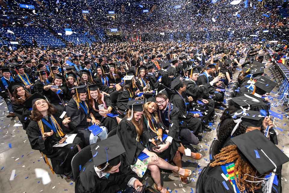 A crowd of graduates in caps and gowns