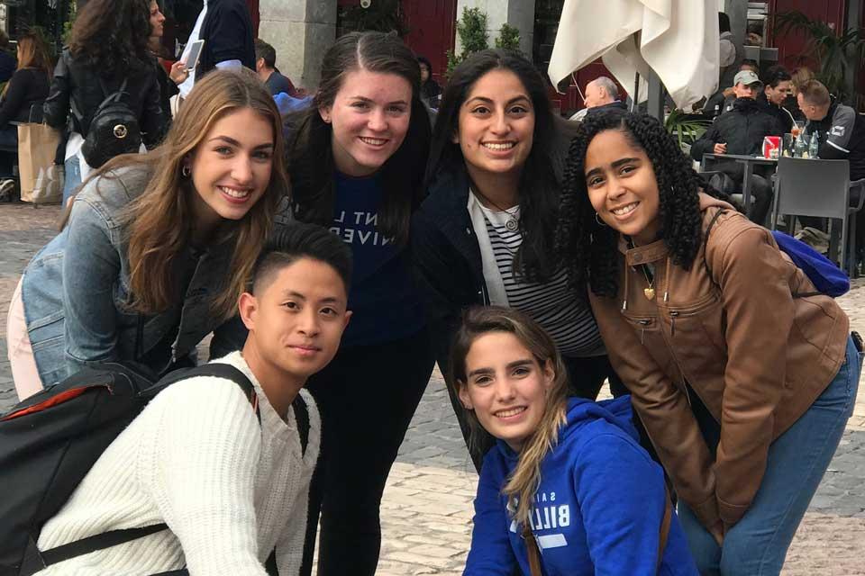 A group of 博彩网址大全 students outside in a city plaza in Madrid 