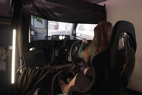 A teen using the driving simulator described in the story.